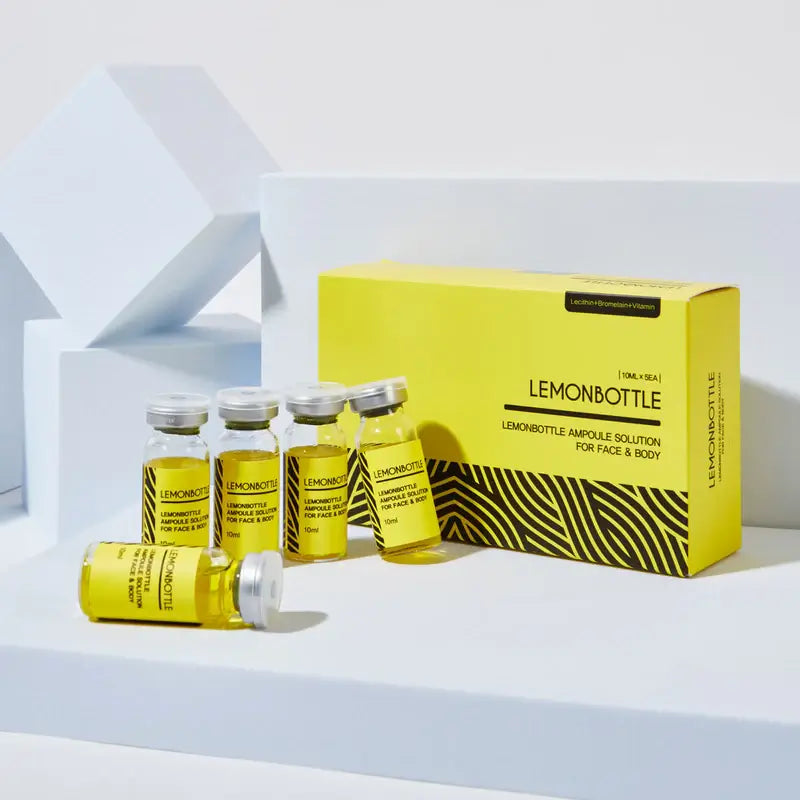 Yellowampoules and packaging with 'Lemonbottle' branding on a white background. Lemonbottle fat dissolver for targeted body fat reduction.